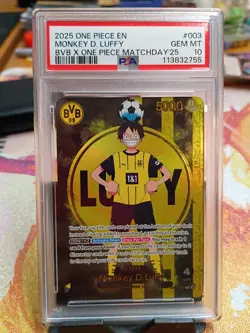 2025 ONE PIECE PROMOS BVB X ONE PIECE MATCH DAY 2025 #003 MONKEY D. LUFFY PSA 10 - Image 1