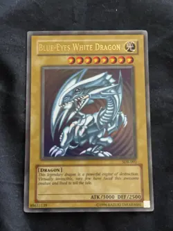 Blue-Eyes White Dragon Ultra Rare SDK-001 English #14 slight bleed. - Image 1