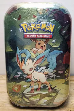 Pokemon Scarlet & Violet—Prismatic Evolutions Mini Tin Leafeon Eevee - Image 1