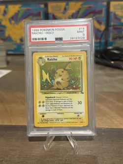 1999 Pokemon Fossil Raichu Holo 14/62 PSA 9 Mint WOTC Vintage Card - Image 1