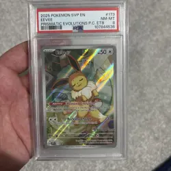 Eevee Prismatic Evolutions ETB Pokemon Center PSA 8 Pokemon English 173 Stamped - Image 1