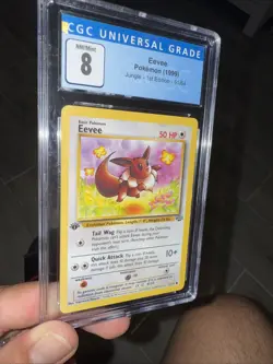 Pokemon Eevee 1st Edition 1999 Jungle CGC NM/Mint Grade 8 - Image 1