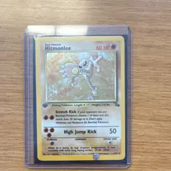 Pokemon Hitmonlee 1st Edition Holo Rare Fossil 1999 Card 7/62 - Image 1
