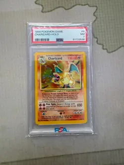 1999 POKEMON BASE SET UNLIMITED #4 CHARIZARD-HOLO PSA 7 - Image 1