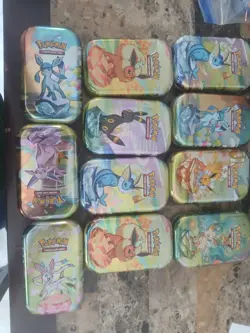Pokemon Lot 11 Tins (Empty) And Over 600 Cards Good Shape Low Start At 1 Penny - Image 1