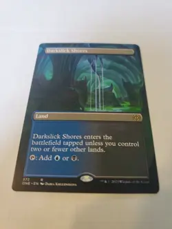 Darkslick Shores (Borderless) Phyrexia: All Will Be One Regular - Image 1
