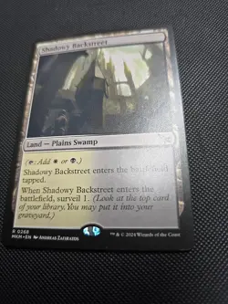 Shadowy Backstreet MKM #268 MTG Murders at Karlov Manor Rare Land WB NM - Image 1