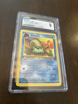 1999 Pokemon Fossil First Edition #52 - Omanyte CGC 9 - Image 1