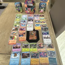 Pokemon TCG -40 cards & Mega Charizard Empty tin with Promo card + 2 small tins - Image 1