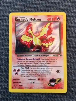Rocket's Moltres - 12/132 - Cosmos Holo - Swirl - Gym Heroes (2000) - Pokemon - Image 1