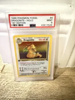 1999 Pokemon Fossil 1st Edition Dragonite #4 PSA 9 - Image 1