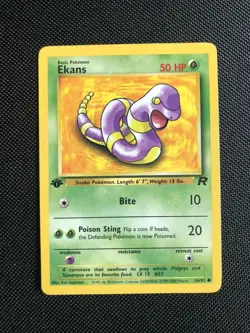 1st Edition Ekans 56/82 Team Rocket Pokemon Card w/ Top Loader Free Shipping - Image 1