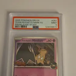 Pokemon Team Rocket's Mimikyu Staff Prerelease PSA 9 Holo 087/182 2025 - Image 1