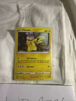 Pokemon Tcg Pikachu holding Present SWSH234 Pokemon Go - Image 1