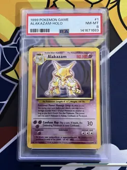 1999 POKEMON BASE SET UNLIMITED #1 ALAKAZAM-HOLO PSA 8 - Image 1