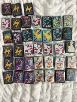 Lot Of 38 Pokemon ETB Card Sleeves - Image 1
