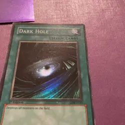 YUGIOH Super Rare Dark Hole LOB-E041 1st Edition LP Excellent - Image 1