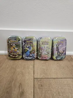 Pokemon TCG Prismatic Mini Tins Sealed - Umbreon, Vaporeon, Jolteon, Sylveon - Image 1