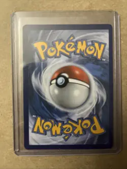 Rockruff SM06 Black Star Promo COSMOS Holo Pokemon Card LP 2017 Small Crease - Image 2