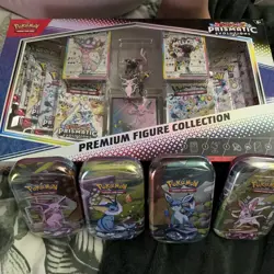 Pokemon TCG Prismatic Evolutions Premium Figure Collection & 4 Prismatic Tins - Image 1