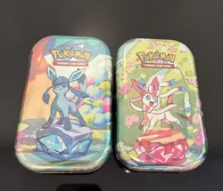 POKEMON TCG : PRISMATIC EVOLUTIONS TINS- Lot Of 2 Glaceon/Slyveon - Image 1