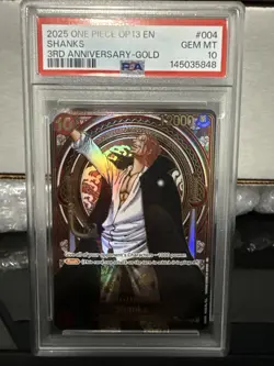 2025 ONE PIECE OP13-CARRYING ON HIS WILL 3RD ANNIVERSARY-GOLD #004 SHANKS PSA 10 - Image 1