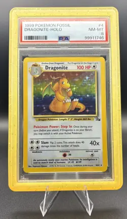 1999 POKEMON FOSSIL #4 DRAGONITE-HOLO PSA 8 - Image 1