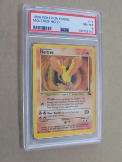 1999 Pokemon Fossil Moltres Holo Card #12 PSA 8 - Image 1