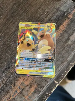 Raichu & Alolan Raichu GX 54/236 TAG TEAM Holo – Unified Minds + card saver - Image 1