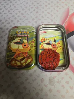 *EMPTY NO PACKS* Pokemon Prismatic Mini Tin Includes Art Card & Coin. Flareon - Image 1
