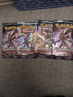 4 Pokemon TCG Sun And Moon Guardians Rising Booster Packs - Image 1