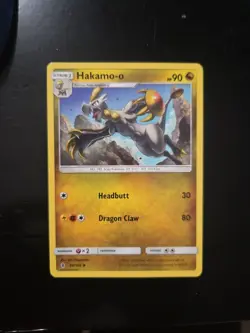 Hakamo-o 99/145 SM Guardians Rising Pokemon NM Sun & Moon - Image 1