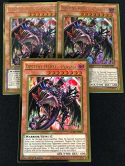 Yugioh Destiny Hero Plasma MGED-EN007 1ST GOLD X3 (LP) - Image 1
