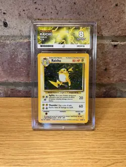 Pokemon TCG Raichu Base Set Holo Rare Card 14/102 Graded Ace 8 Near Mint 1999 - Image 1