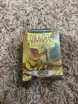 Dragon Shield 100 Standard Card Sleeves Gold Classic - Image 1