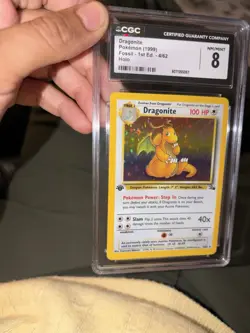 Dragonite Fossil 1st Edition Holo Rare CGC 8 Pokemon Card 4/62 (1999) - Image 1