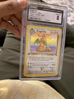 Dragonite Fossil 1st Edition Holo Rare CGC 8 Pokemon Card 4/62 (1999) - Image 2