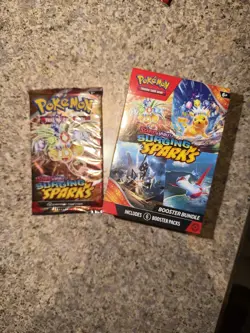 Pokemon Surging Sparks Booster Bundle (6 Packs) And One zmemmmm Booster Pack - Image 1
