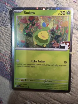Budew 004/131 - Prize Pack Series 7 Pokemon COSMOS Holo - Image 1