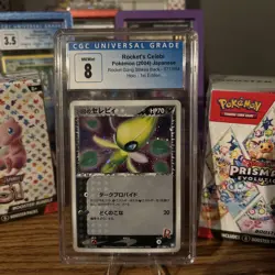 2004 POKEMON JPN ROCKET GANG STRIKES BACK 1ST EDITION ROCKET'S CELEBI Grade 8 - Image 1