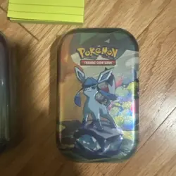 POKEMON TCG TIN~SCARLET & VIOLET: MINI PRISMATIC EVOLUTIONS (1) Styles May vary - Image 1