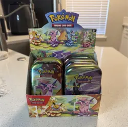 Pokemon Prismatic Evolutions Mini Tins Display 5 Tins Opened - Image 1