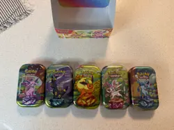 Pokemon Prismatic Evolutions Mini Tins Display 5 Tins Opened - Image 2