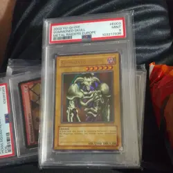 2002 YU-GI-OH! MRD-METAL RAIDERS #003 SUMMONED SKULL PSA 9 - Image 1