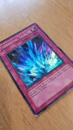 Heavily Played Unlimited Ultra Rare Torrential Tribute LON-025 YuGiOh card - Image 1
