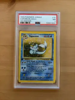 1999 POKEMON JUNGLE 1ST ED #12 VAPOREON-HOLO PSA 7 - Image 1