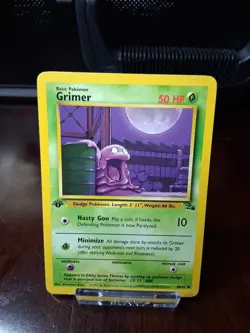1st Edition Grimer 48/62 Fossil Common Pokemon Card - LP Minus - Image 1