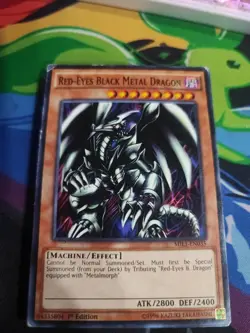 YUGIOH RED-EYES BLACK METAL DRAGON MIL1-EN035 COMMON 1ST ED Damaged - Image 1