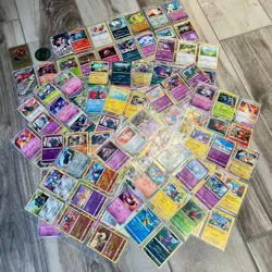 Lot of 134 Assorted Pokemon Trading Cards in Binder Sleeves + EX Chip - Image 1