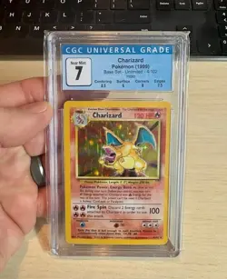 1999 Pokemon Charizard Holo CGC Universal Grade 7 NM Game #4/102 - Image 1